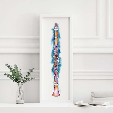 Framed artwork of a colorful clarinet on a white wall with minimal decor.