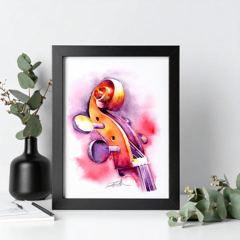 Framed artwork of a colorful violin on a white surface with decorative elements.