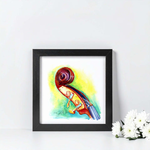 Framed colorful painting of a violin on a white surface with flowers.