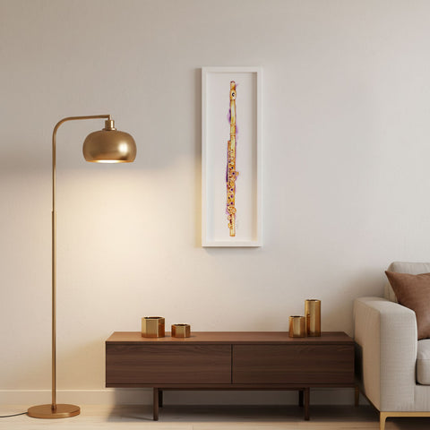 Modern living room with gold floor lamp, wooden console table, and beige sofa and a painting.