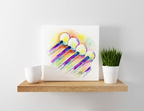 Colorful abstract art piece of percussion mallets on a wooden shelf with a plant and a cup.
