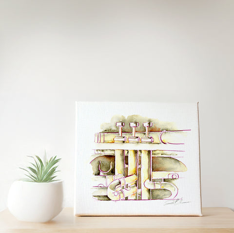 Canvas print of musical instruments on a white wall with a small plant below.