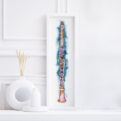 Framed artwork of a clarinet on a white wall with decorative elements.