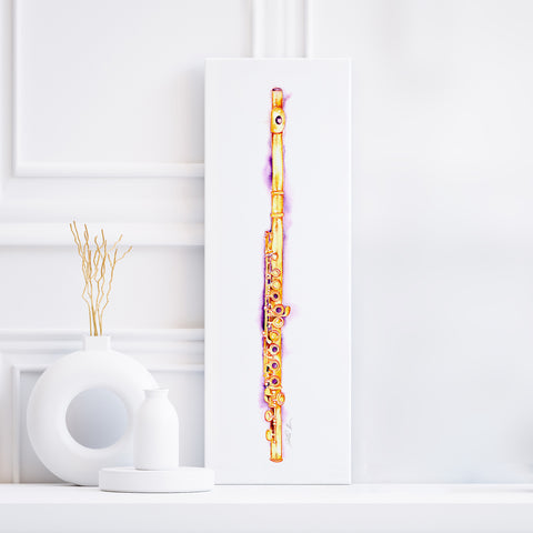 A framed painting of a gold flute on a white wall, with a decorative object to the left.