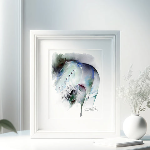 A framed watercolor painting of a harp displayed on a white wall, with a decorative vase and picture frame.
