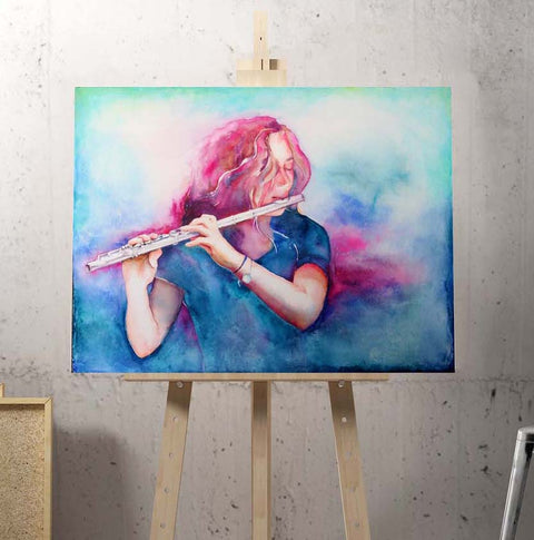 A watercolor painting of a woman playing a flute, displayed on an easel with a colorful backdrop.