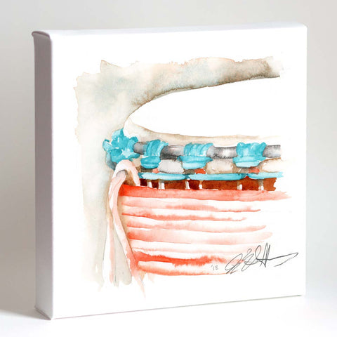A framed watercolor art print of a djembe drum with vibrant coral and turquoise hues on a white background