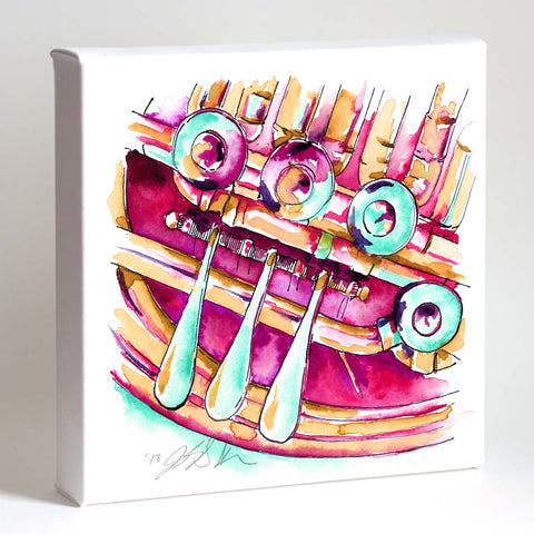 A framed watercolor painting of a raspberry colored French horn with detailed keys