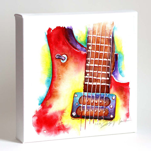 A colorful painting of an electric guitar on white paper, with bold red and yellow hues, framed in a white frame.