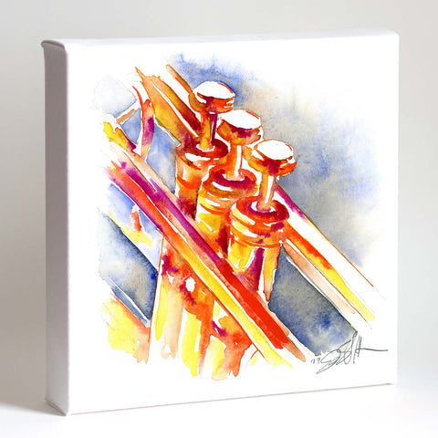 A framed print of an abstract painting featuring tangerine orange trumpets with colorful accents on white background.