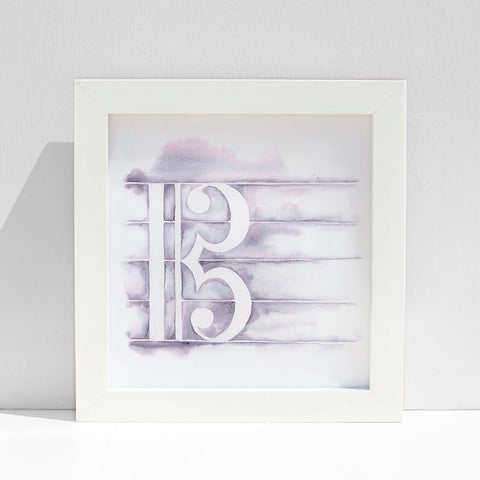 A framed artwork depicting a musical clef symbol with a purple and white marbled effect on high-quality paper.
