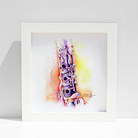 An 8" x 8" watercolor painting of an Oehler clarinet, featuring vibrant colors and a white frame, displayed against a neutral background.