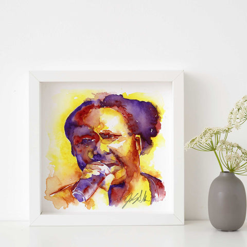 A framed watercolor painting of a singer with a microphone, featuring vibrant colors and abstract styles.