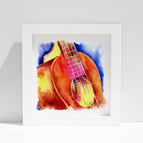 A colorful watercolor painting of a ukulele with a focus on the soundhole, featuring warm sienna and vibrant cobalt blue hues, displayed against a white background in a framed style.