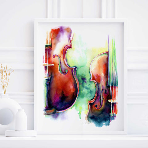 A watercolor painting of two violins with abstract multicolored backgrounds, displayed in a frame.