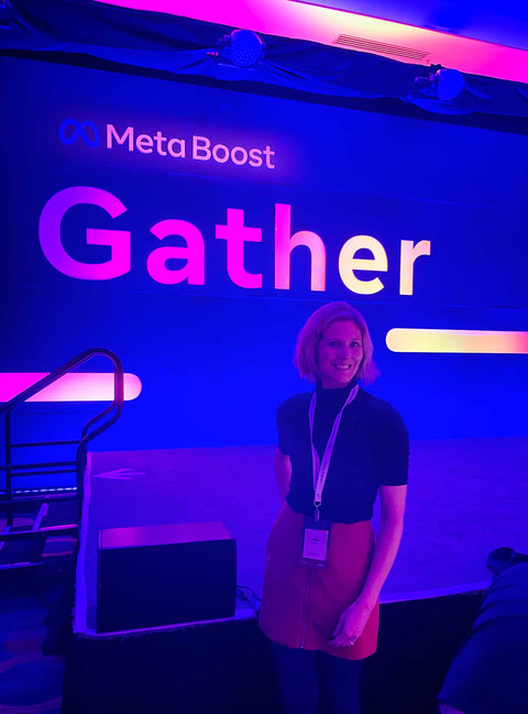 jamie in front of the meta bost gather sign