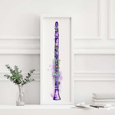 Framed artwork of a purple clarinet on a white surface with a vase and books in the background.