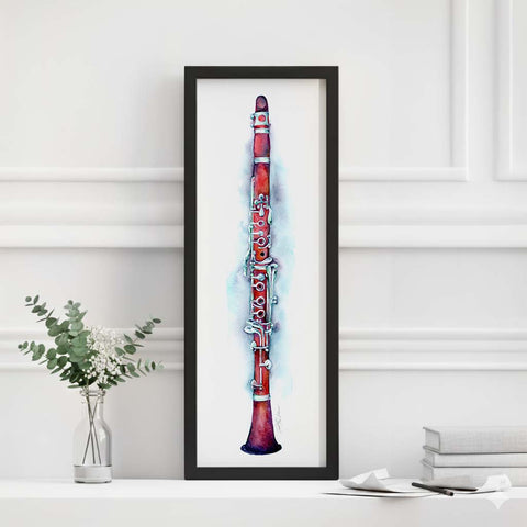 Framed artwork of a red clarinet on a white wall with decorative elements.