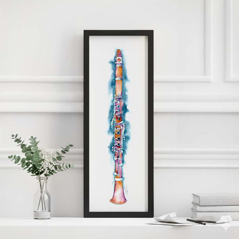 Framed artwork of a colorful clarinet on a white wall with minimal decor.