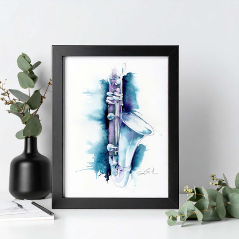 Framed artwork of a clarinet with watercolor design on a white background, surrounded by greenery.