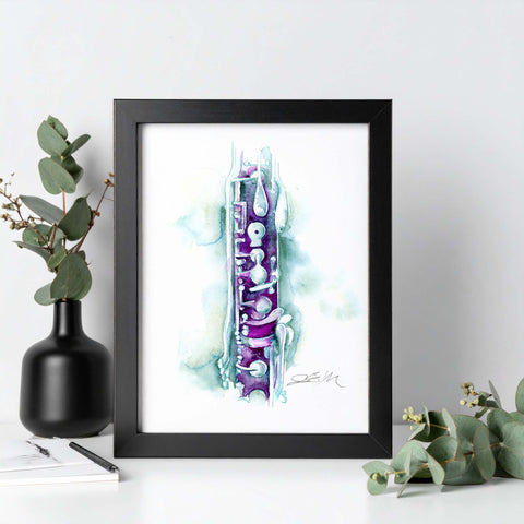Framed artwork of a colorful musical instrument abstract design on a white wall with decorative elements.