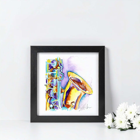 Framed artwork of a colorful saxophone on a white background with flowers.
