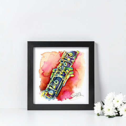 Framed artwork of a colorful oboe on a white background with flowers.