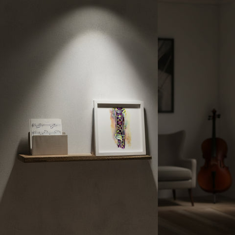 Framed clarinet artwork on a shelf with a blurred background