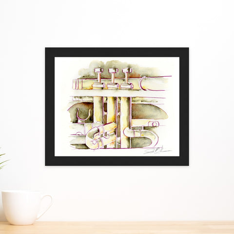 Framed abstract art piece on a white wall with a cup on a surface below.