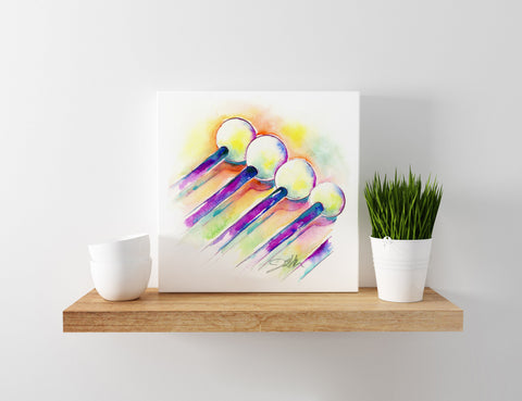 Colorful abstract art piece of percussion mallets on a wooden shelf with a plant and a cup.