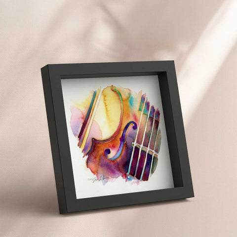 Framed artwork of a colorful violin or viola on a beige background