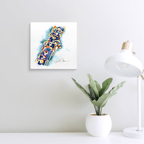 Blue and gold oboe painting on a wall