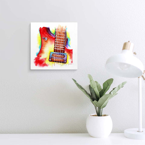 Red and yellow electric guitar painting on a wall